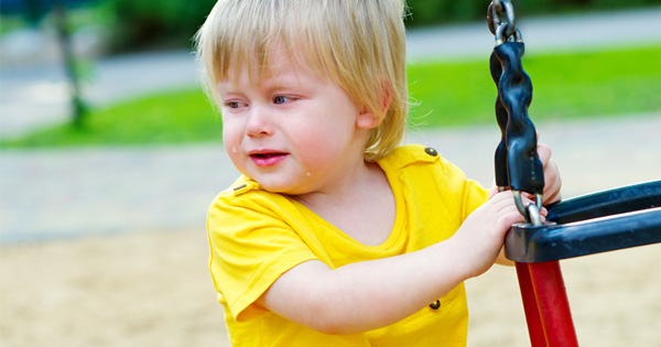 Woman Goes To Playground And Walks Over To A Little Boy. Then She Puts Something Into His Mouth.